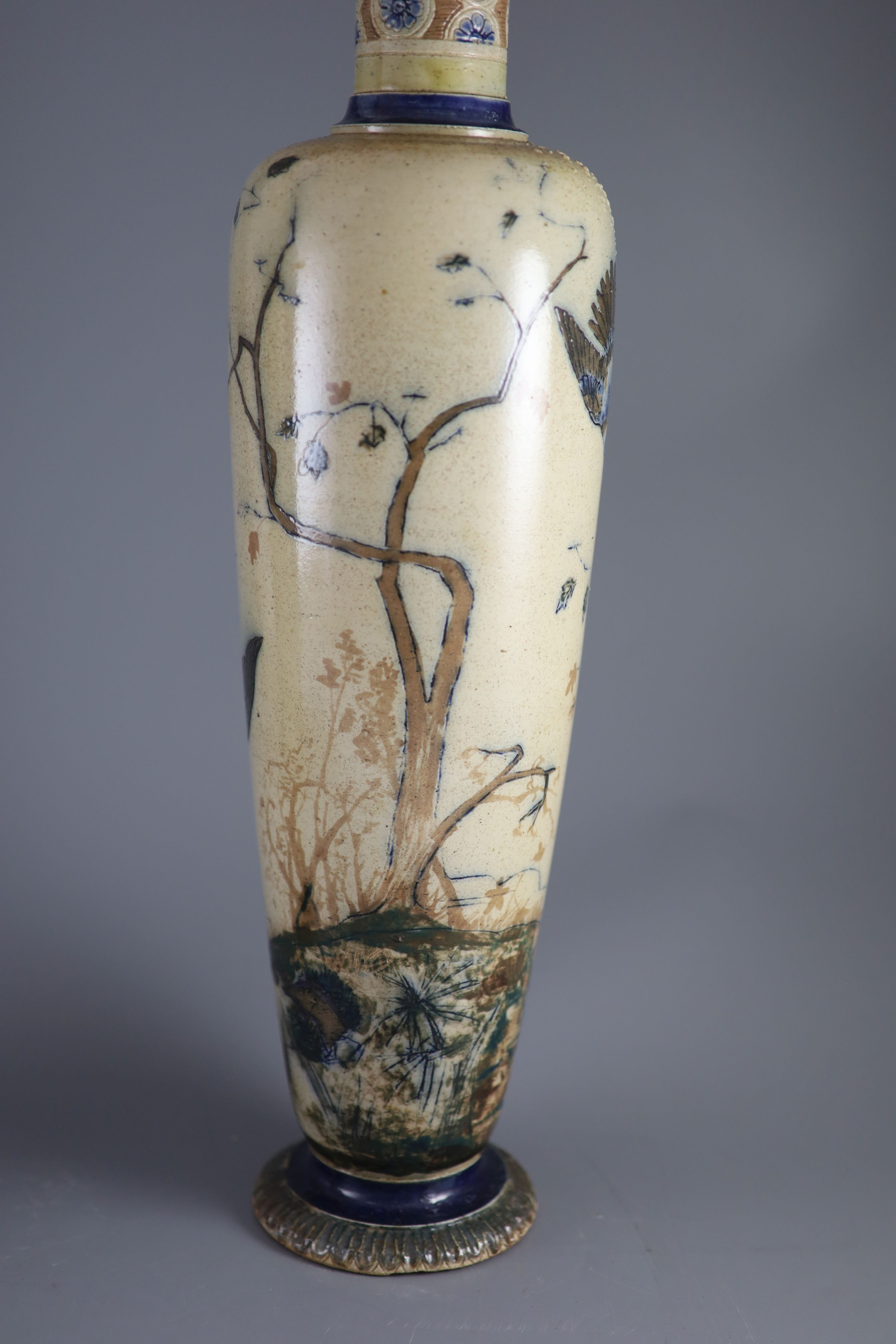 A pair of large Martin Brothers 'eagle and vulture' stoneware vases, dated 1878,